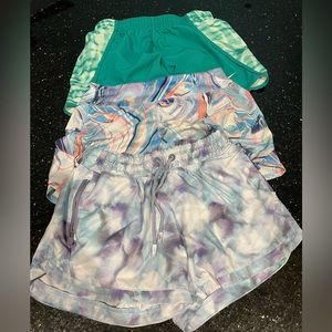 Three pairs of athletic shorts for girls. 2 Athleta girl/one Nike